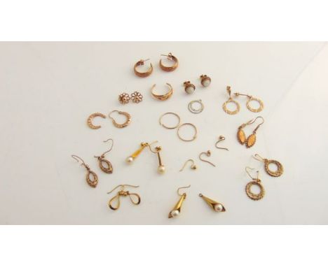 A pair of opal stud earrings, in 9ct gold; a ruby ring, band cut; eleven pairs of various earrings, mostly 9ct gold, 12.6g in