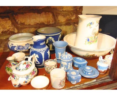 A collection of Wedgwood Jasperwares including a dark blue ground jardinière and matching jug, pale blue Jasperwares includin
