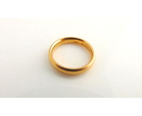 A 22ct gold wedding band, size K, 5.5g
