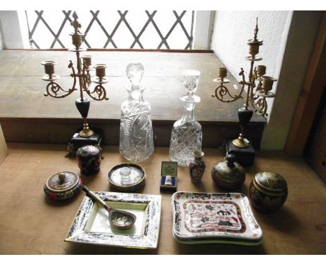 A pair of gilded four divisional metalwork candelabra with scrolling supports and finial lid to central wells, raised on squa