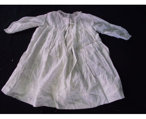 A box containing an assortment of vintage textiles to include christening gowns, further infants clothing, lacework, etc (ite
