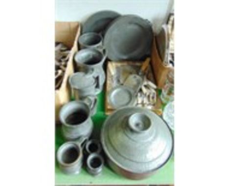 A quantity of antique pewter wares to include two plate warmers marked Compton, London, large tankards to include a quart exa