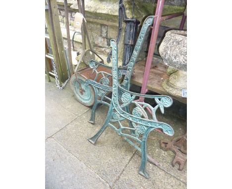 A small vintage "Ironcrete" garden roller, a further small cast iron hand operated water pump and a pair of cast iron bench e
