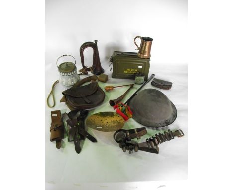 A box containing a mixed assortment of 20th century military effects to include an unmarked helmet with all over blackened fi