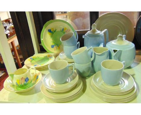 A small collection of A J Wilkinson Clarice Cliff tea wares with pink, yellow and blue crocus decoration comprising a cake pl