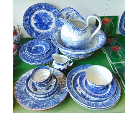 A collection of 19th century and other blue and white printed wares including a jug and basin set with chinoiserie style land