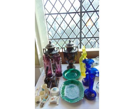 A collection of 19th century and other ceramics and glassware including a pair of two handled black ground vases and covers w