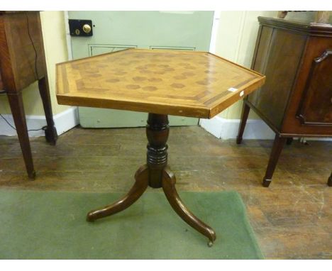 A 19th century occasional table, the hexagonal top with tumbling cube parquetry top, turned pillar and tripod