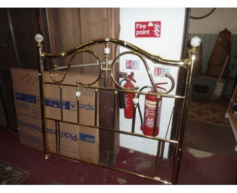 A Victorian style polished brass framed 4ft 6 bed head with white glazed ceramic finials with transfer printed floral detail
