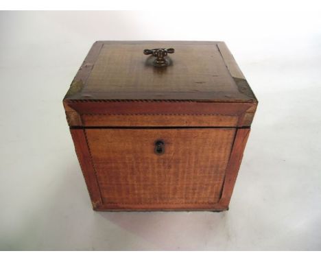 A good quality Regency boxed tea caddy, principally veneered in walnut with banded and further inlaid borders, the hinged lid