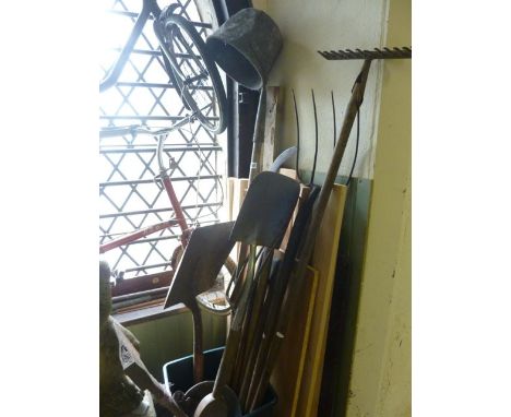 A selection of vintage and later garden hand tools to include forks, spades, bill hook slasher and a selection of scoops incl
