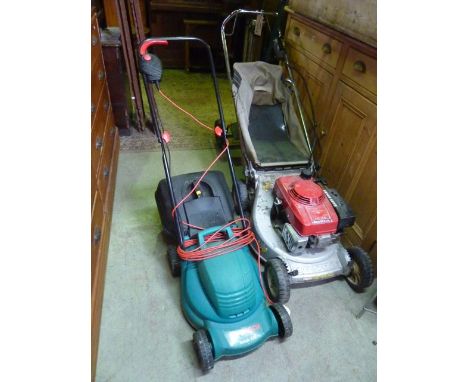 A Honda HR194 rotary petrol driven lawn mower together with a Bosch Rotak 320 electric lawn mower with grass collection box a