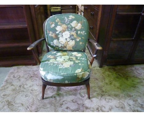 An Ercol dark stained beechwood low hoop and stickback open elbow armchair 