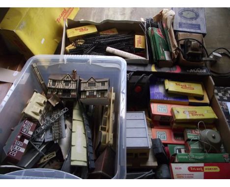 A box containing a quantity of vintage model railway effects to include Hornby TT gauge rolling stock and track, etc together