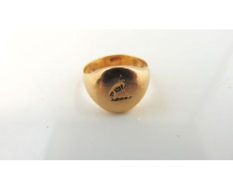 An 18ct gold signet ring, with crest, size K 1/2, 7.3g