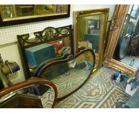 An Edwardian kidney shaped wall mirror with moulded frame and scrolling acanthus detail together with two contemporary wall m