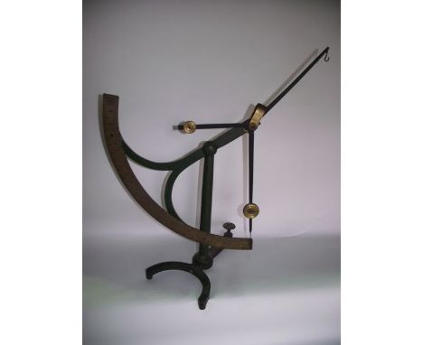 A vintage iron framed paper weighing scales across a brass axis stamped Goodbrand & Co Limited, Makers Stalybridge,  1/420 Lb