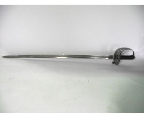 An 1887 heavy cavalry officer's sword with honeysuckle hilt complete with scabbard, marked 38479 to back of blade