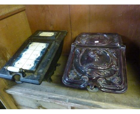 A vintage cast iron and enamel coal scuttle, the hinged lid with scrolling dragon, acanthus and further detail and initialled