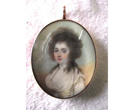 An 18th century portrait miniature of oval form showing a waist length study of a brown eyed lady with brown ringletted hair 