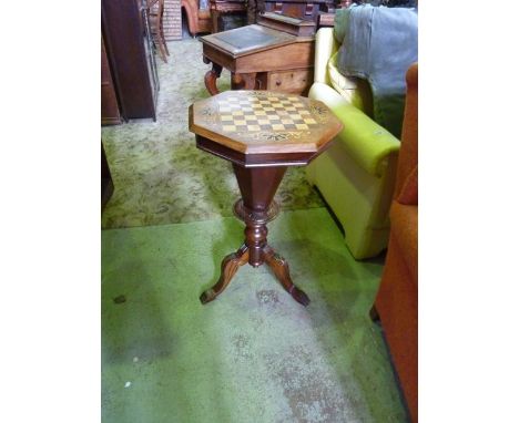 A Victorian walnut trumpet shaped sewing/work box of octagonal form, the hinged lid with inlaid games/chequer board raised on