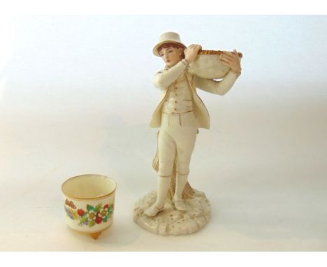 A 19th century Royal Worcester figure of a boy carrying a basket on his shoulder standing beside a tree trunk, with gilt deco