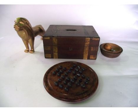 A 19th century rosewood veneered case with brass banded detail and flush fitting campaign type handle, the hinged lid reveali