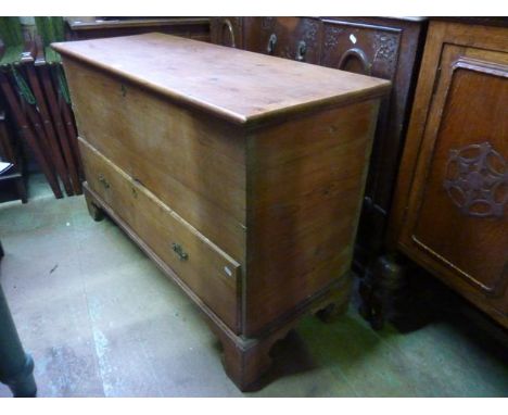 A 19th century stripped pine blanket/mule chest with hinged lid over a long drawer and bracket supports