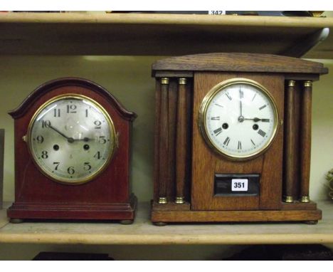An Edwardian oak cased mantle clock with turned column support and eight day striking movement and one other similar