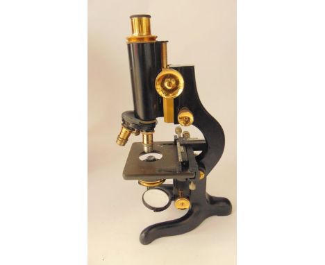A good quality vintage mahogany cased microscope by W Watson & Sons Limited, London, stamped Service, also stamped 63454, the