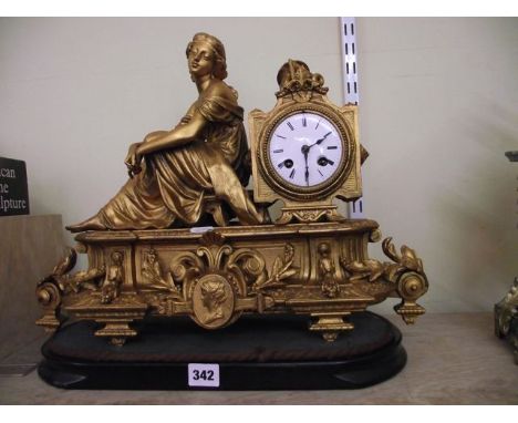 A 19th century gilt spelter mantle clock on a classical theme with eight day striking movement