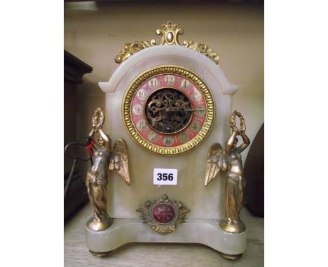 A Victorian alabaster mantle clock with painted dial and further applied gilded detail in the form of angels, etc