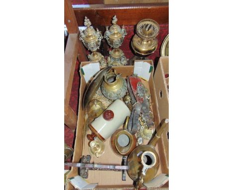 An assortment of eastern and other brassware to include a pair of lidded pierced vases, a brass oil lamp, substantial eastern