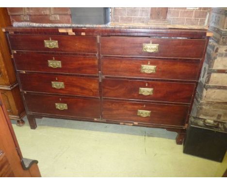 A substantial 19th century mahogany chest of eight short graduated drawers in a side by side arrangement with bracket shaped 
