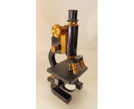 A vintage mahogany cased microscope stamped HF Angus & Co, London, England
