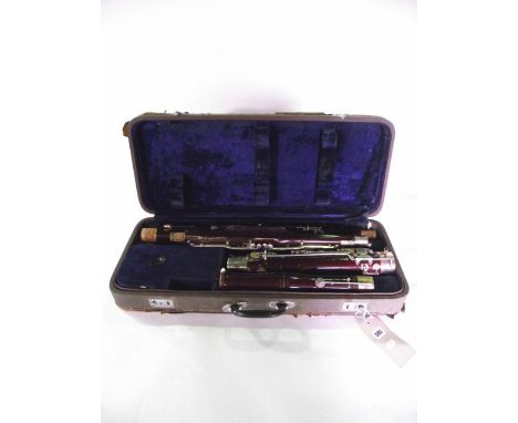 A vintage cased Chinese made Lark Brand students bassoon in four sections