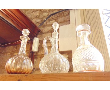 A good quality clear cut-glass bell-shaped decanter, with mushroom-shaped stopper, together with a clear-cut glass ewer with 