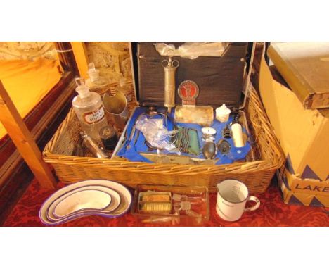 A collection of vintage medical equipment to include a graduating trio of kidney shaped enamelled dishes, a 10 oz mug, three 