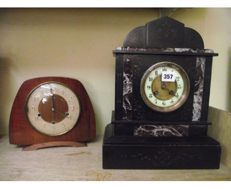 A Victorian black slate and marble mantle clock with eight day striking movement