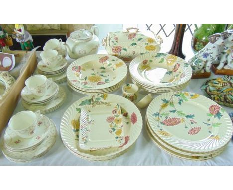 A collection of late 19th century dinner wares with printed and infilled chrysanthemum decoration comprising a rectangular tw