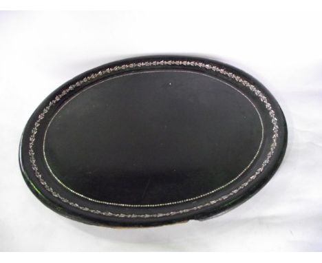 A substantial 19th century papier-mache tray of oval form with lacquered blackened ground with two borders inlaid with mother