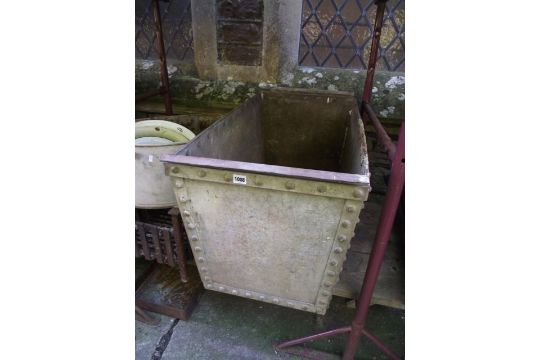 A heavy guage galvanised steel tank heavy tapered rectangular form