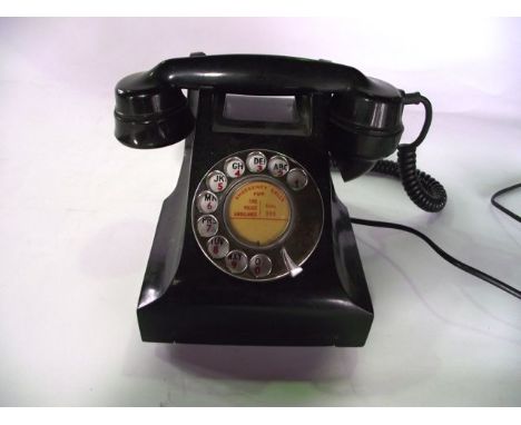 A vintage black Bakelite cased finger dial telephone