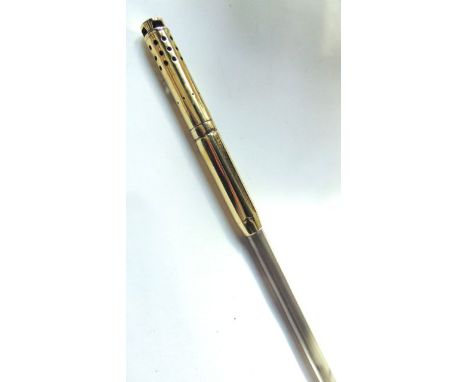 A brass capped lamp lighter's pole