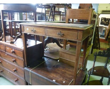 An Edwardian rosewood writing table of rectangular form with inset leather panelled top over two frieze drawers with inlaid d