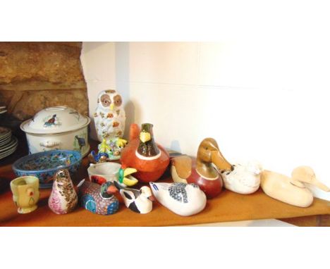 A decorative ceramic model of an owl with impressed mark to base MMA, further models of birds including a coloured glass exam
