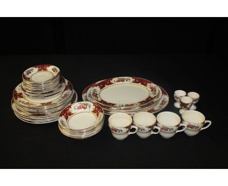 Sampson &amp; Son ltd. porcelain tea and dinner service, the burgundy borders with gilt foliate decoration and foliate cartou