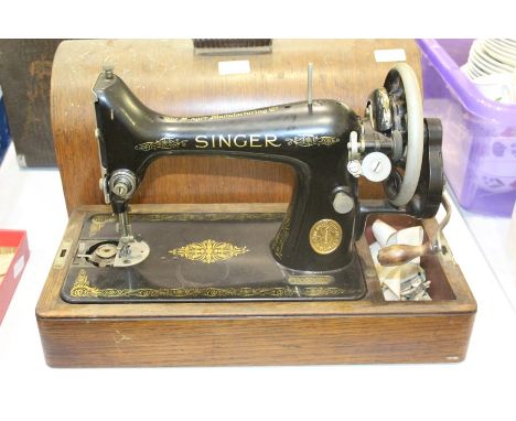 Singer manual sewing machine, housed in a domed fitted case