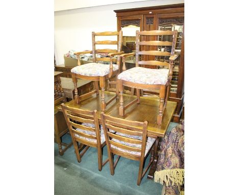 Oak draw-leaf refectory style table, raised on pierced end supports and sledge feet, together with six ladder back dining cha