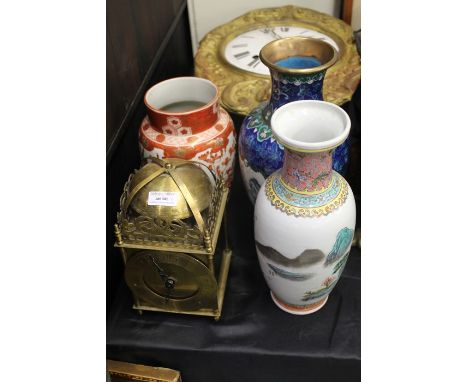 20th century brass lantern clock, cloisonne vase, two Oriental porcelain vases (4)